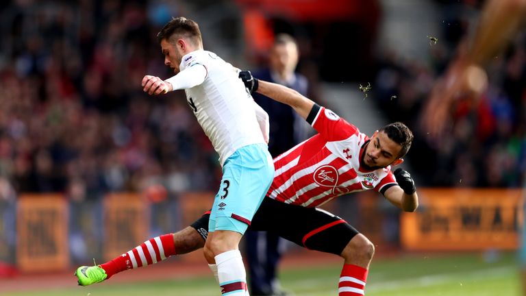 Aaron Cresswell is tackled by Sofiane Boufal 