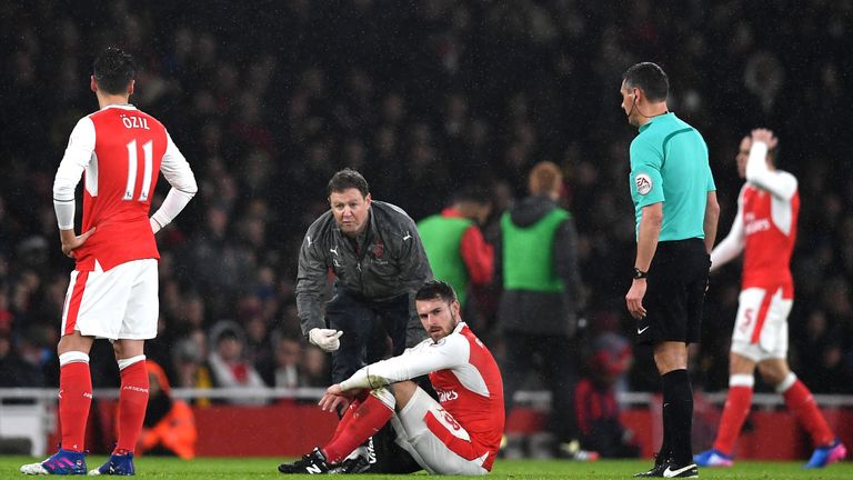 LONDON, ENGLAND - JANUARY 31:  Aaron Ramsey of Arsenal receives medical treatment prior to be substituted during the Premier League match between Arsenal a