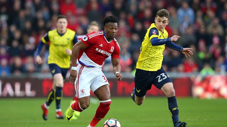 Middlesbrough winger Adama Traore of Middlesbrough (left) attempts to take the ball away from Ryan Ledson of Oxford United