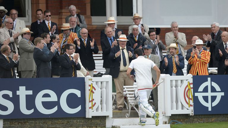 Alastair Cook receives a standing ovation from the MCC members at Lord's
