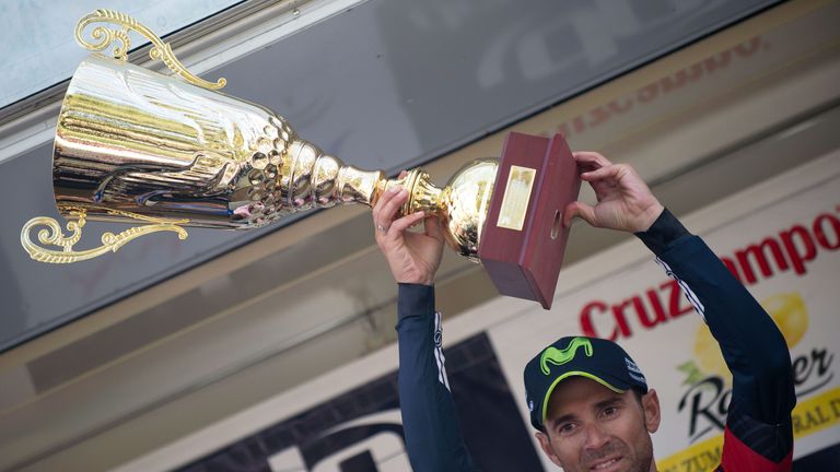 Movistar's Spanish cyclist Alejandro Valverde celebrates on the podium winning the first stage of the "Ruta del Sol" tour, a 155 km ride from Rincon de la 