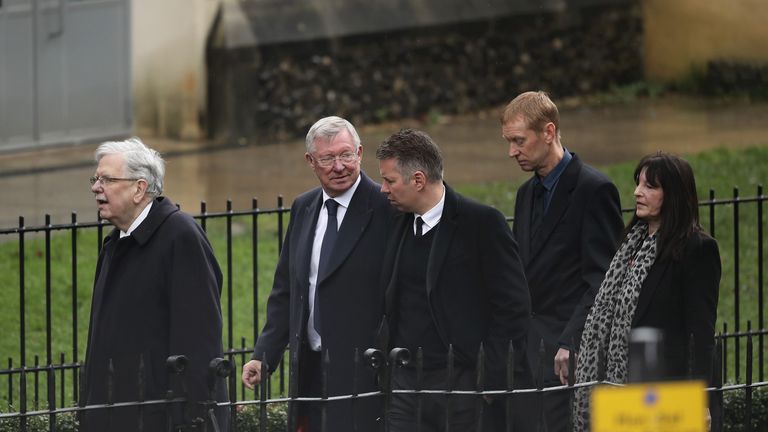 WATFORD, ENGLAND - FEBRUARY 01: Sir Alex Ferguson (2L) and Darren Ferguson (3R) arrive to the funeral of Former England football manager Graham Taylor at S