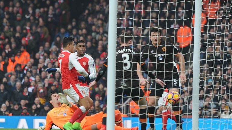 The ball bounces off Alexis Sanchez's hand as Arsenal take a controversial lead against Hull