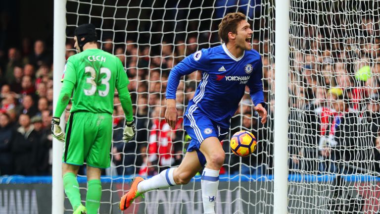 LONDON, ENGLAND - FEBRUARY 04:  Marcos Alonso of Chelsea celebrates after scoring the opening goal during the Premier League match between Chelsea and Arse