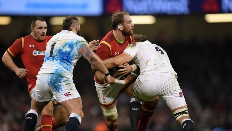 CARDIFF, WALES - FEBRUARY 11 2017:  Alun Wyn Jones of Wales is tackled by Joe Marler and Joe Launchbury of England during the RBS Six Nations 