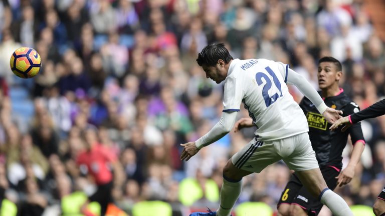 Real Madrid forward Alvaro Morata (left) heads the opening goal against Espanyol