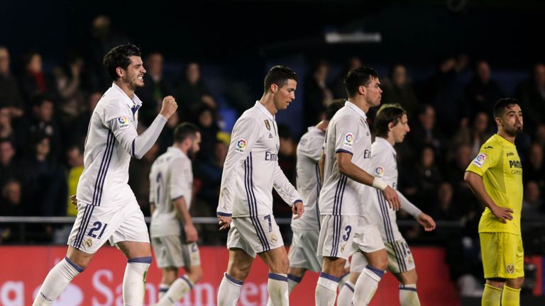 Real Madrid's forward, Alvaro Morata (L), celebrates after scoring the winner against Villarreal