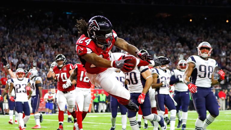 Devonta Freeman #24 of the Atlanta Falcons runs for a 5-yard touchdown in the second quarter against the New England Patriots in Super Bowl LI