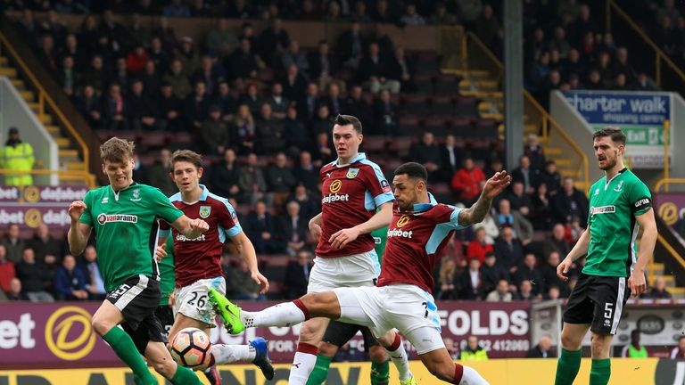 Andre Gray of Burnley (R) shoots during The Emirates FA Cup Fifth Round match between Burnley and Lincoln City at Turf Moor