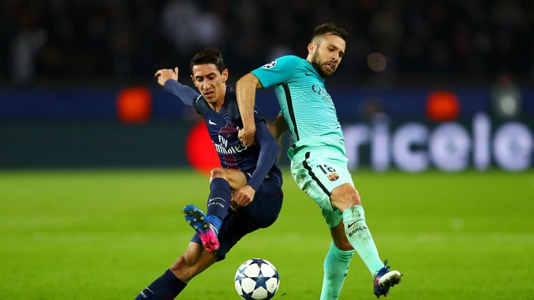 PARIS, FRANCE - FEBRUARY 14:  Jordi Alba of Barcelona battles for the ball with Angel Di Maria of Paris Saint-Germain during the UEFA Champions League Roun