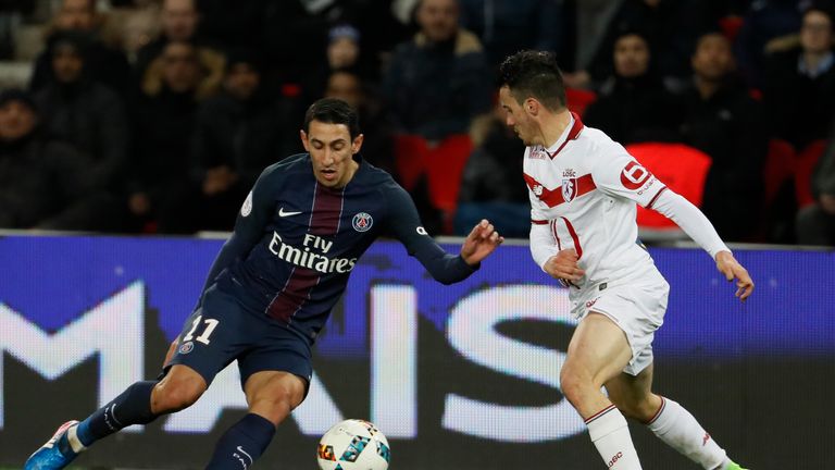 Paris Saint-Germain's Argentinian forward Angel Di Maria (L) drives the ball next to Lille's French defender Sebastien Corchia during the French L1 footbal