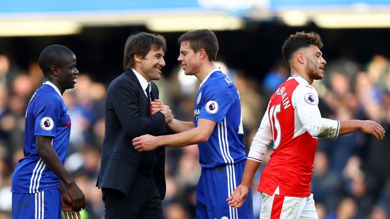Antonio Conte, manager of Chelsea shakes hands with Cesar Azpilicueta after the Premier League match v Arsenal
