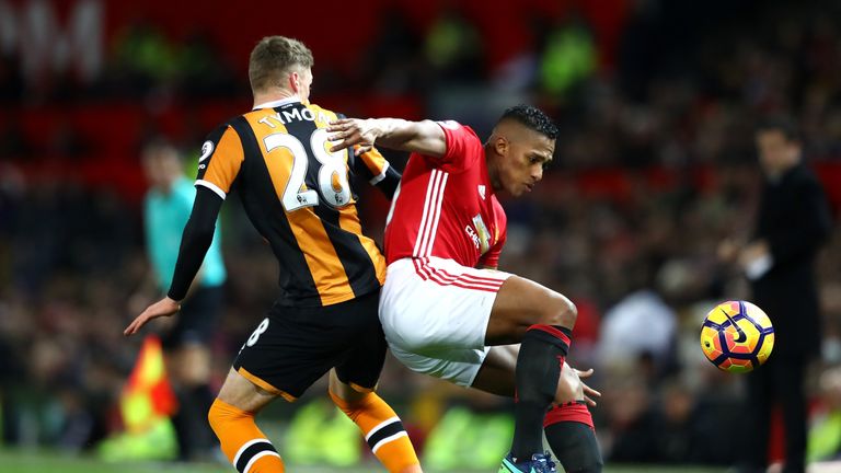 Manchester United's Antonio Valencia of Manchester United is challenged by Josh Tymon