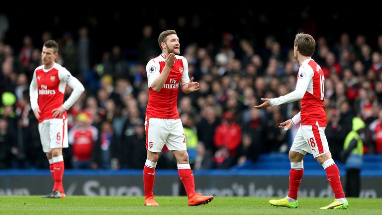 Arsenal's Laurent Koscielny (left), Arsenal's Shkodran Mustafi (centre) and Arsenal's Nacho Monreal (right) appear dejected after Chelsea's Marcos Alonso (