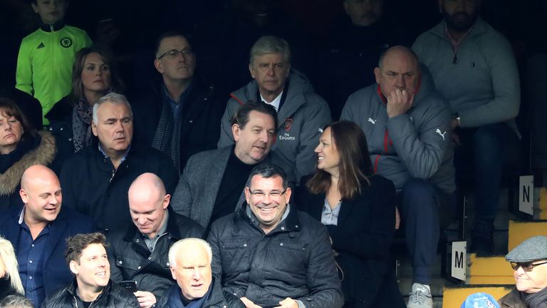 Arsene Wenger  watches from the stands at Stamford Bridge while serving a touchline ban