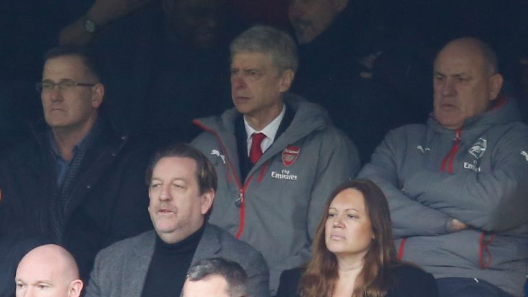 Arsene Wenger watches from the stands at Stamford Bridge as he serves a touchline ban