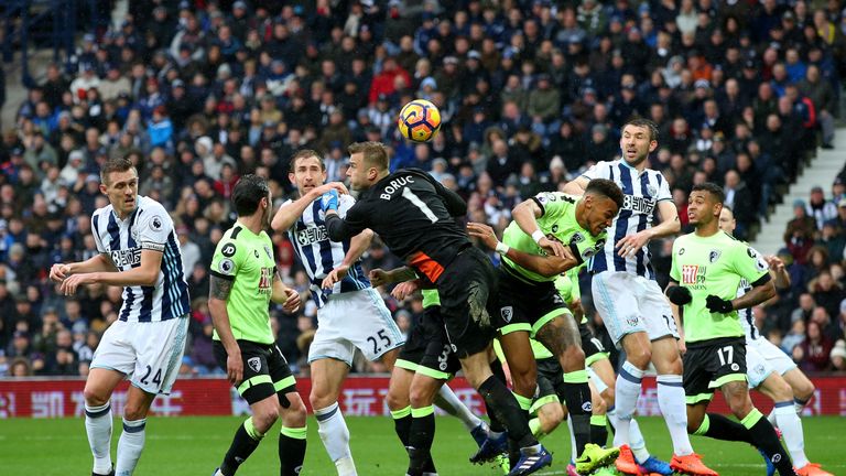 WEST BROMWICH, ENGLAND - FEBRUARY 25:  Artur Boruc of AFC Bournemouth (R) attempts to punch the ball but misses which leads to West Bromwich Albion second 
