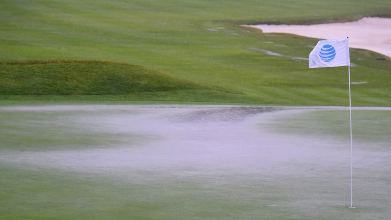 Play was suspended shortly before the greens started to flood