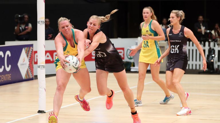 DURBAN, SOUTH AFRICA - JANUARY 28: Caitlin Thwaites of Australia i schallenged by Katrina Grant of New Zealand during the Netball Quad Series match between