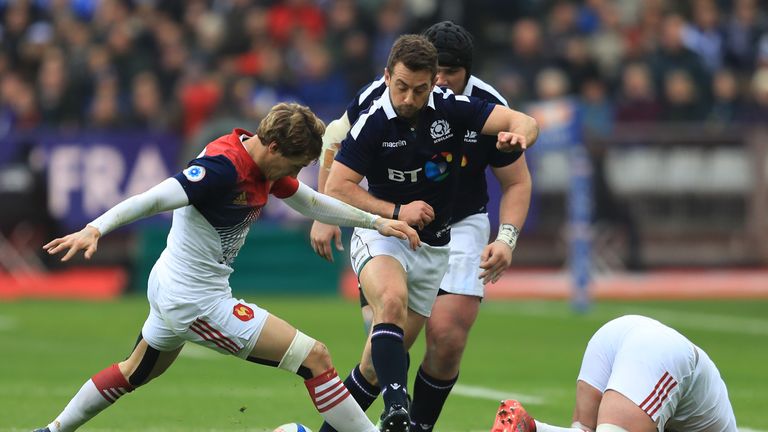 Baptiste Serin of France and Greig Laidlaw of Scotland scramble for a loose ball 