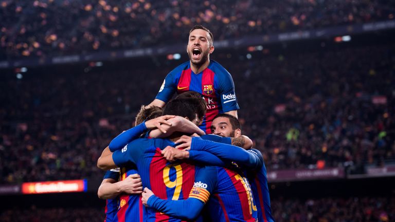 BARCELONA, SPAIN - FEBRUARY 07:  Players of FC Barcelona celebrate after their teammate Luis Suarez scored the opening goal during the Copa del Rey semi-fi