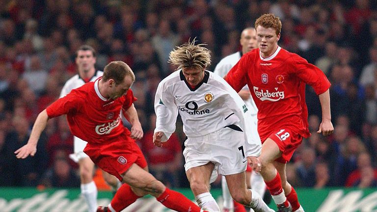 CARDIFF, WALES - MARCH 2:   David Beckham battles for the ball with Liverpool's Danny Murphy during the Worthington Cup Final between Manchester United v L