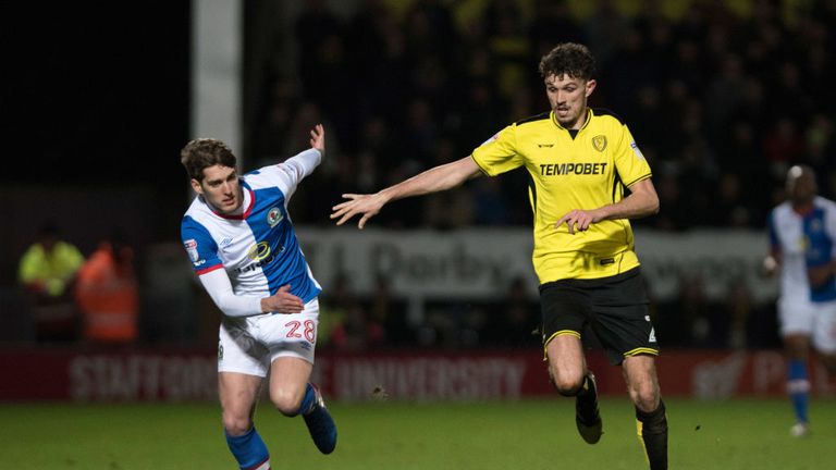 BURTON-UPON-TRENT, ENGLAND- FEBRUARY 24: Connor Mahoney of Blackburn Rovers and Tom Flanagan of Burton Albion in action during the Sky Bet Championship mat