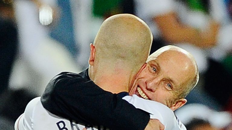 Bob Bradley hugs his son Michael Bradley after USA defeated Algeria in the 2010 FIFA World Cup