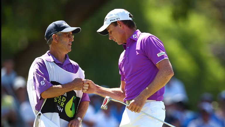 PERTH, AUSTRALIA - FEBRUARY 19: Brett Rumford of Australia celebrates with his caddie after a birdie putt on the shoot out hole in match seventeen of the m