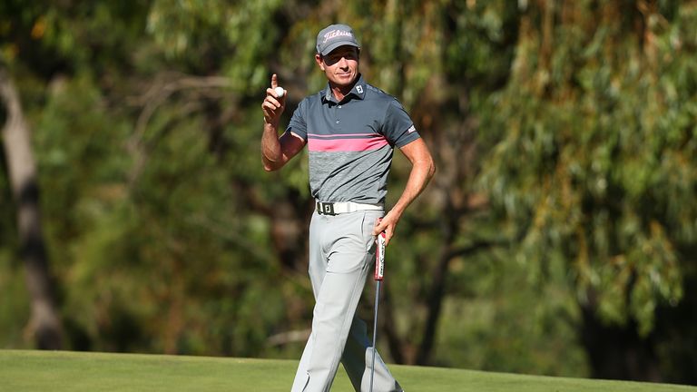 PERTH, AUSTRALIA - FEBRUARY 17: Brett Rumford of Australia acknowledges the gallery on the 18th green after completing his round during round two of the IS