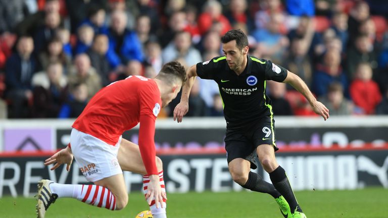 Barnsley's Angus MacDonald (left) and Brighton & Hove Albion's Sam Baldock battle for the ball during the Sky Bet Championship match at Oakwell, Barnsley