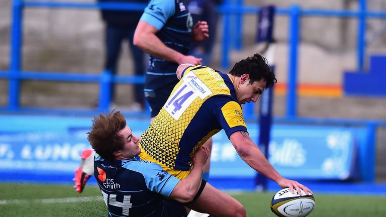 CARDIFF, WALES - FEBRUARY 04: Bryce Heem of Worcester Warriors scores a try as he is tackled by Teri Gee of Cardiff Blues during the Anglo-Welsh Cup match 