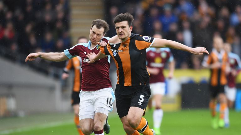 HULL, ENGLAND - FEBRUARY 25: Ashley Barnes of Burnley (L) and Harry Maguire of Hull City (R) battle for possession during the Premier League match between 