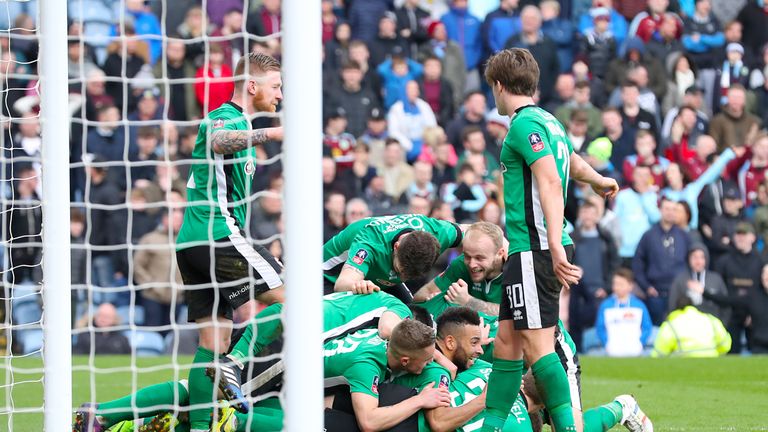 Lincoln City's Sean Raggett celebrates scoring his side's first goal of the game with team mates during the Emirates FA Cup, Fifth Round match at Turf Moor