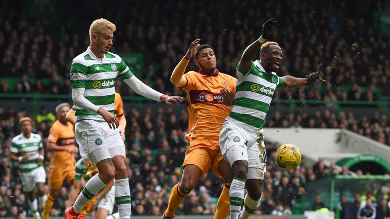 Celtic's Moussa Dembele (right) is brought down by Zak Jules to win a penalty