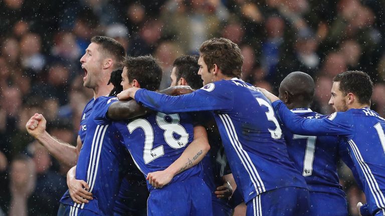 Chelsea players including Chelsea's English defender Gary Cahill (L) celebrate their second goal scored by Chelsea's Spanish midfielder Pedro during the En