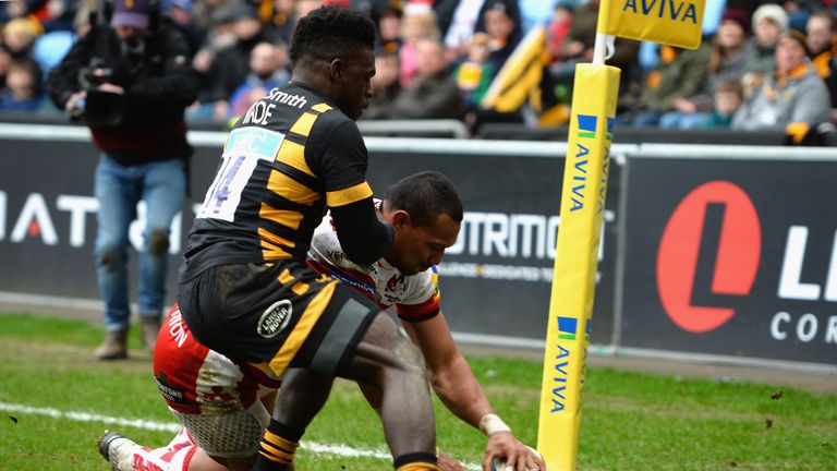 Christian Wade of Wasps tackles David Halaifonua of Gloucester Rugby as he scores a try