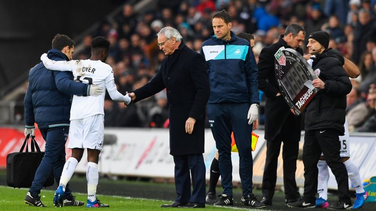 Claudio Ranieri shakes hands with an injured Nathan Dyer 