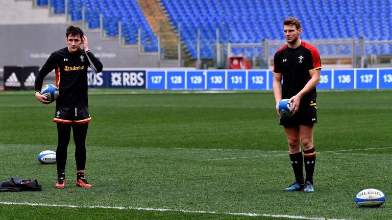 Welsh Sam Davies (L) and Dan Biggar attend the "Captain Run" training on the eve of the Six Nations rugby union match Italy vs Wales, on February 4, 2017