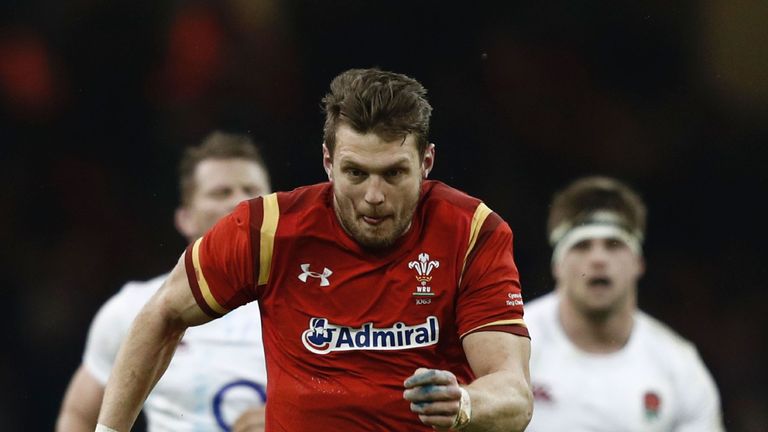 Wales' fly-half Dan Biggar (C) charges through the England defence during the Six Nations on 11/02/2017