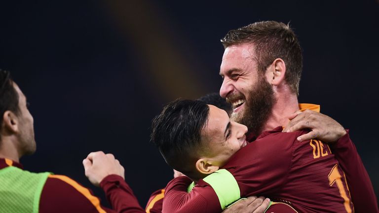 Roma's midfielder from Italy Daniele De Rossi (R) celebrates after Roma's defender from Argentina Federico Fazio scored during the Italian Serie A football
