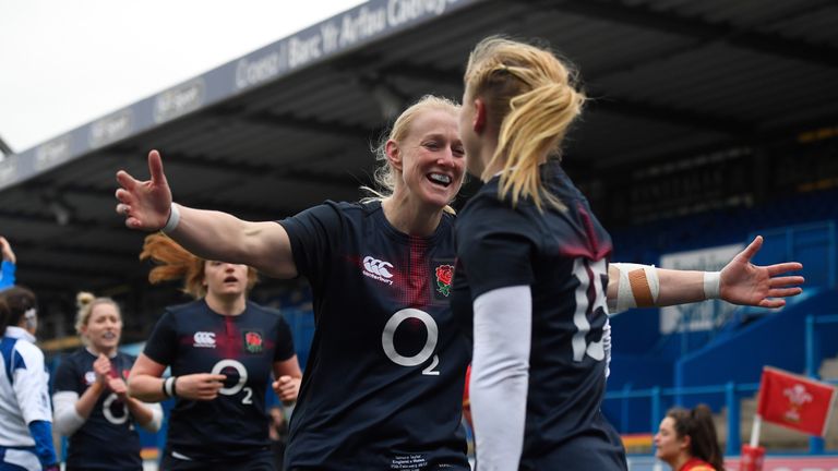 CARDIFF, WALES - FEBRUARY 11:  Danielle Waterman (R) of England is congratulated by teammate Tamara Taylor of England after scoring her team's eighth try d