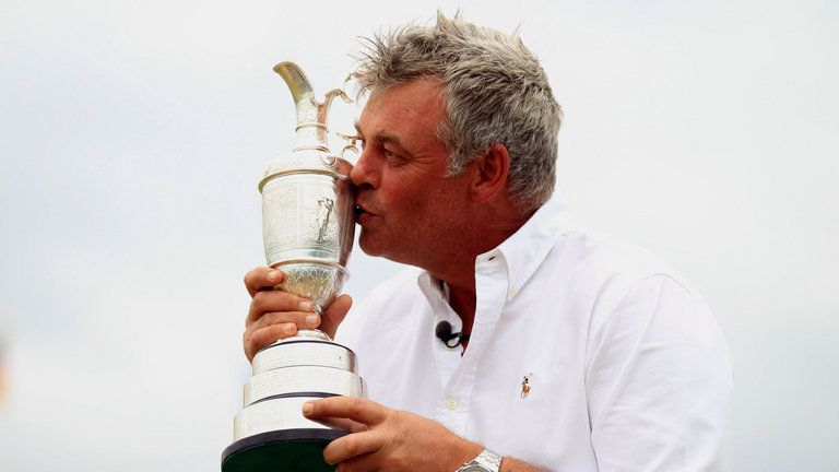 Darren Clarke poses with the Claret Jug after his Open win at Royal St George's