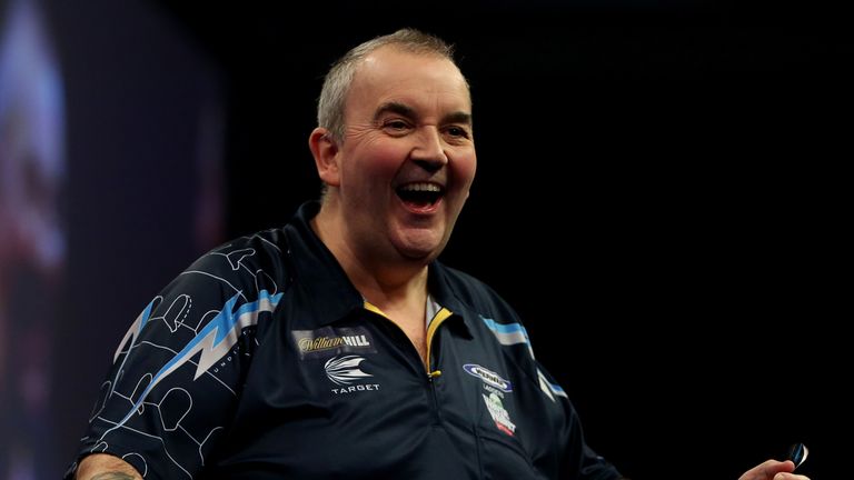 Phil Taylor of England celebrates winnin a set during the final of the 2015 William Hill PDC World Darts Championships
