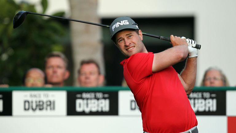 David Lingmerth of Sweden follows his ball after playing a shot during the Dubai Desert Classic golf tournament at the Emirates Golf Club in Dubai on Febru