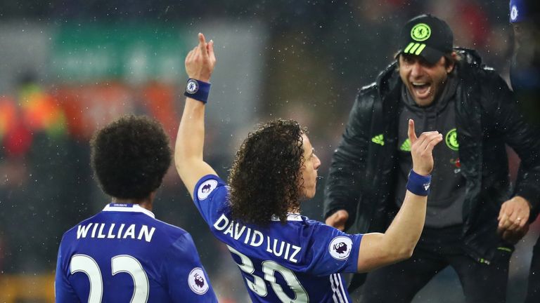 LIVERPOOL, ENGLAND - JANUARY 31:  David Luiz (C) of Chelsea celebrates scoring the opening goal with his team mate Willian (L) and manager Antonio Conte (R