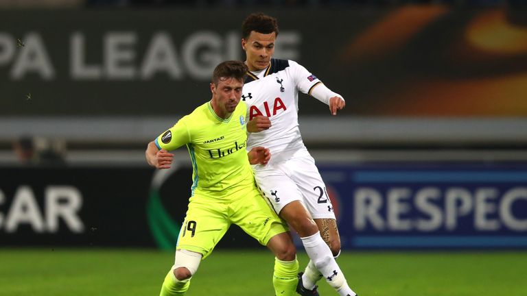 GENT, BELGIUM - FEBRUARY 16:  Dele Alli of Tottenham Hotspur and Brecht Dejaegere of KAA Gent in action during the UEFA Europa League Round of 32 first leg