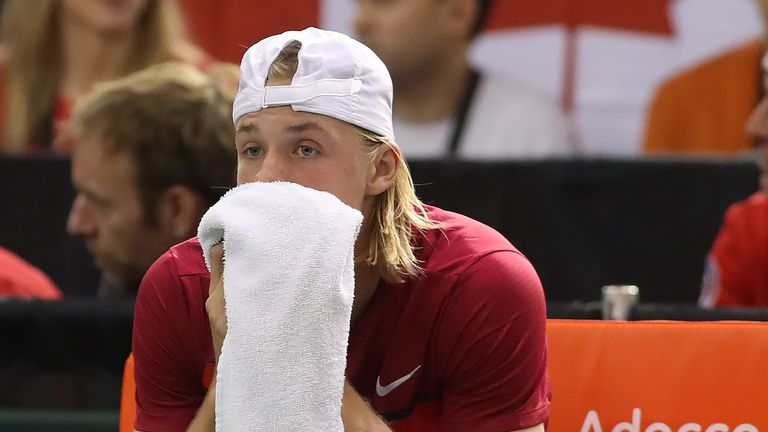 Denis Shapovalov looks on after accidentally hitting referee Arnaud Gabas in the eye during his Davis Cup match against Great Britain
