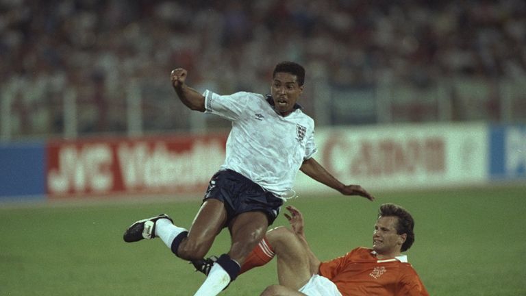 16 Jun 1990:  Des Walker (left) of England is tackled by Hans Gilhaus  of Holland during the World Cup match in Cagliari, Italy. The match ended in a 0-0 d