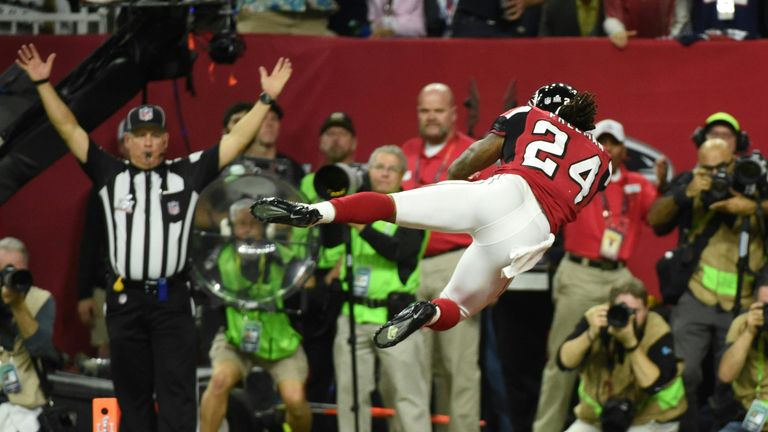 Devonta Freeman #24 of the Atlanta Falcons scores a touchdown on a 5 yard run against the New England Patriots in the second quarter during Super Bowl 51 a
